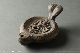 Lucerna com máscara de sátiro